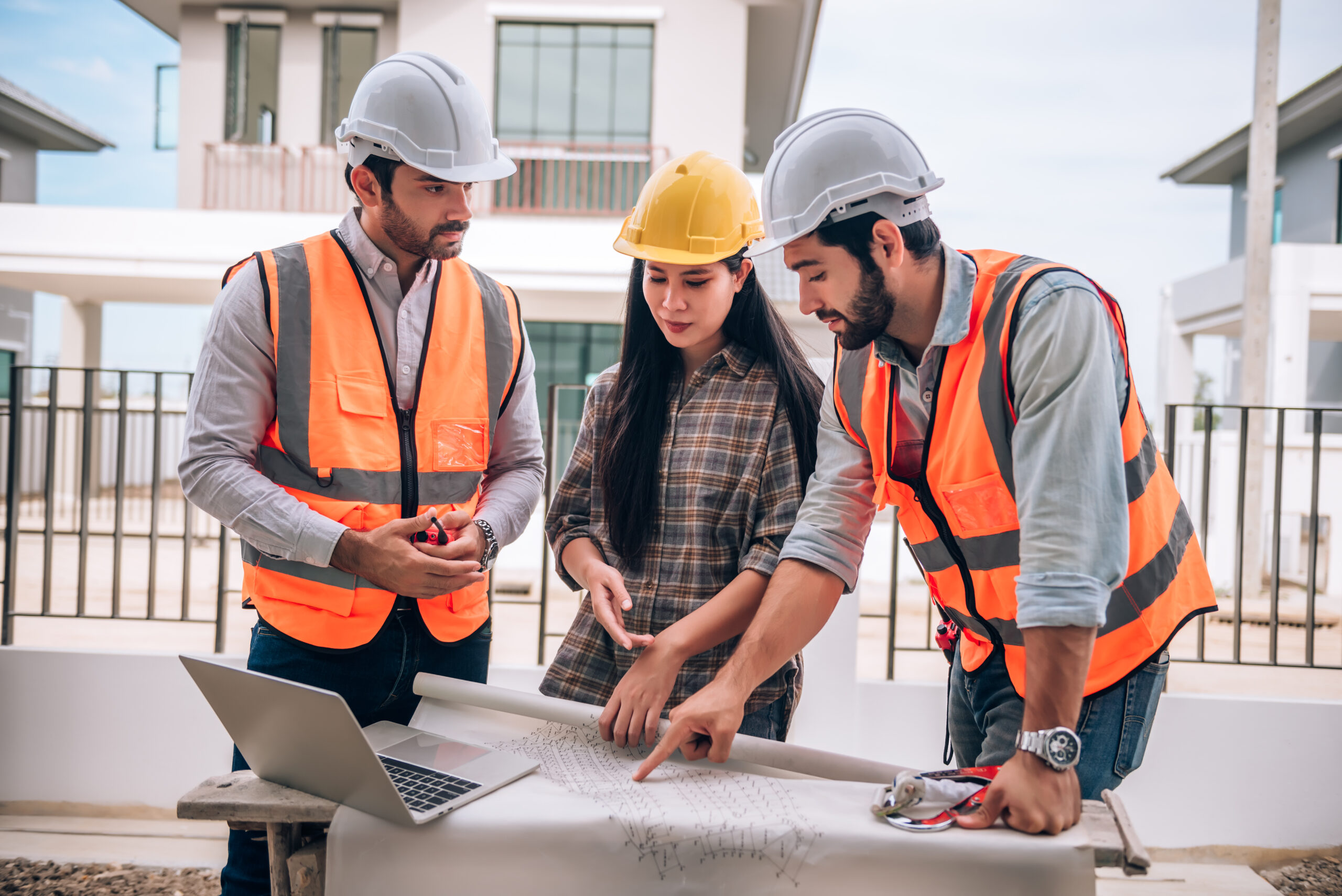 Home Repair 56 civil engineer construction worker architects wearing hardhats safety vests are working together construction site building home cooperation teamwork concept scaled