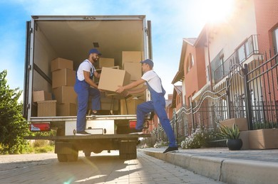 Home Repair 71 workers unloading boxes van outdoors 260nw 2044334057